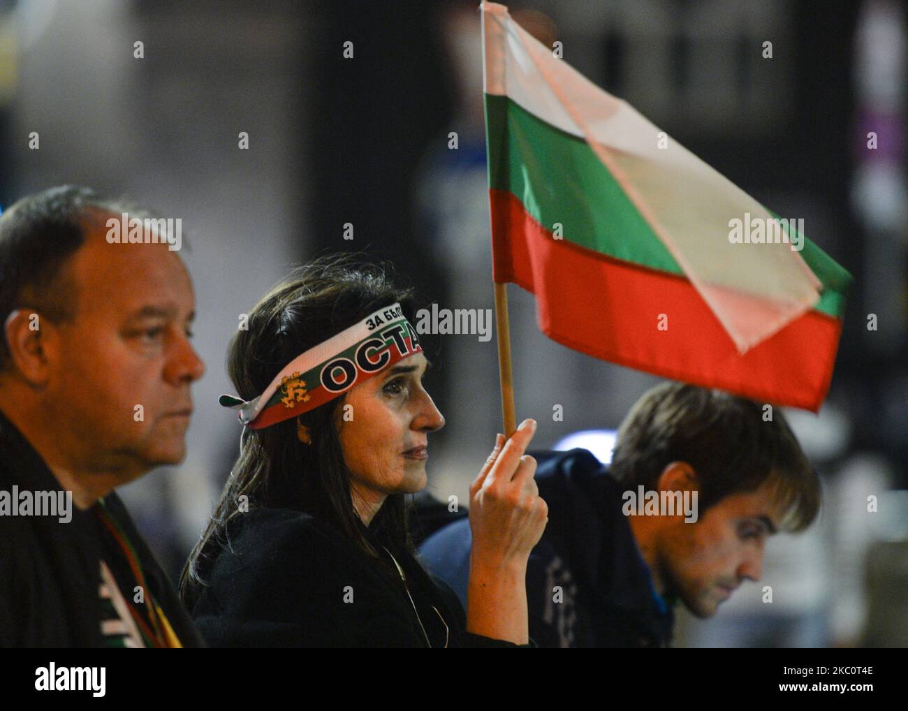 A protester holds a Bulgarian national flag on the 82nd day of anti-government protest on in Sofia, in the Triangle of Power (the space between the buildings of the Presidency, the National Assembly and the Council of Ministers). For nearly three months people have been taking part in daily protests against corruption, demanding the resignation of the government of Boyko Borissov, in power since 2009. On Monday, September 28, 2020, in Sofia, Bulgaria. (Photo by Artur Widak/NurPhoto) Stock Photo