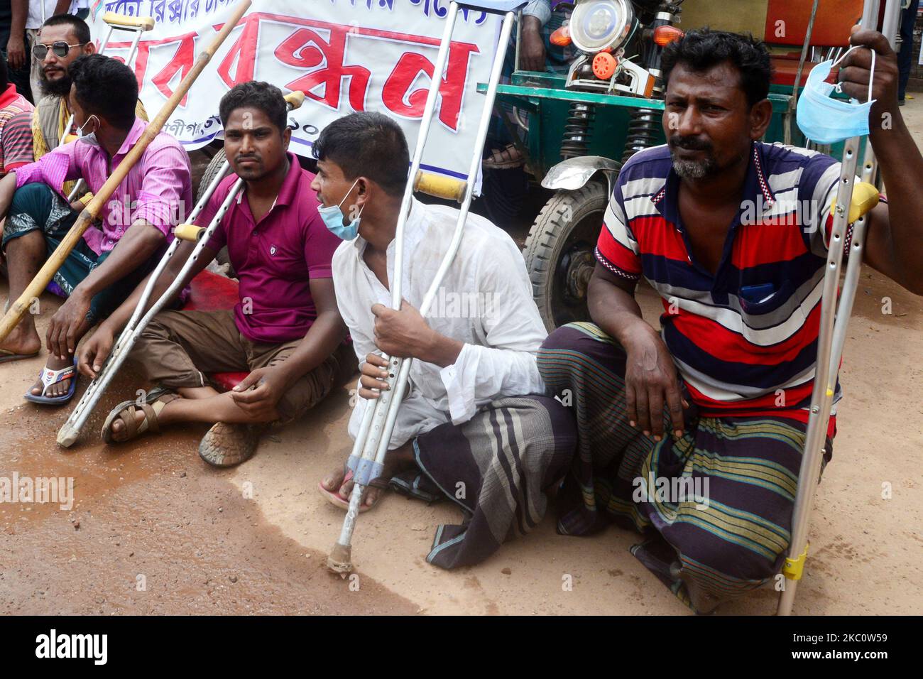 Bangladeshi Disable auto rickshaw driver held a human chain demanding ...