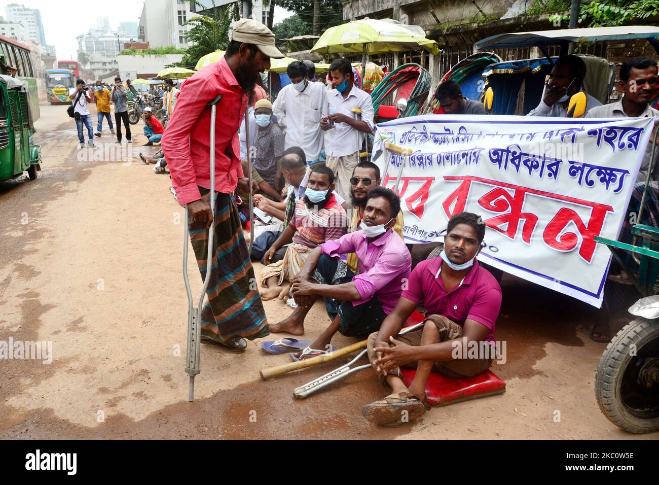 Bangladeshi Disable auto rickshaw driver held a human chain demanding ...