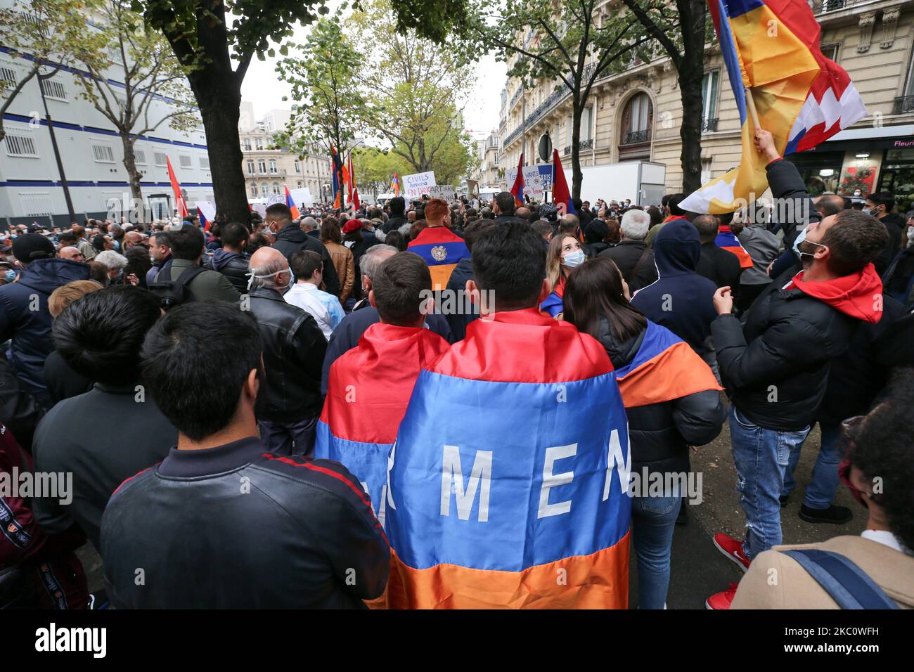 Men hold a flag of Armenia during a demonstration of Armenians in front of the Azerbayan ambassy in Paris, France, on September 29, 2020 against the Azerbayan attacks on Nagorno Karabakh. (Photo by Michel Stoupak/NurPhoto) Stock Photo