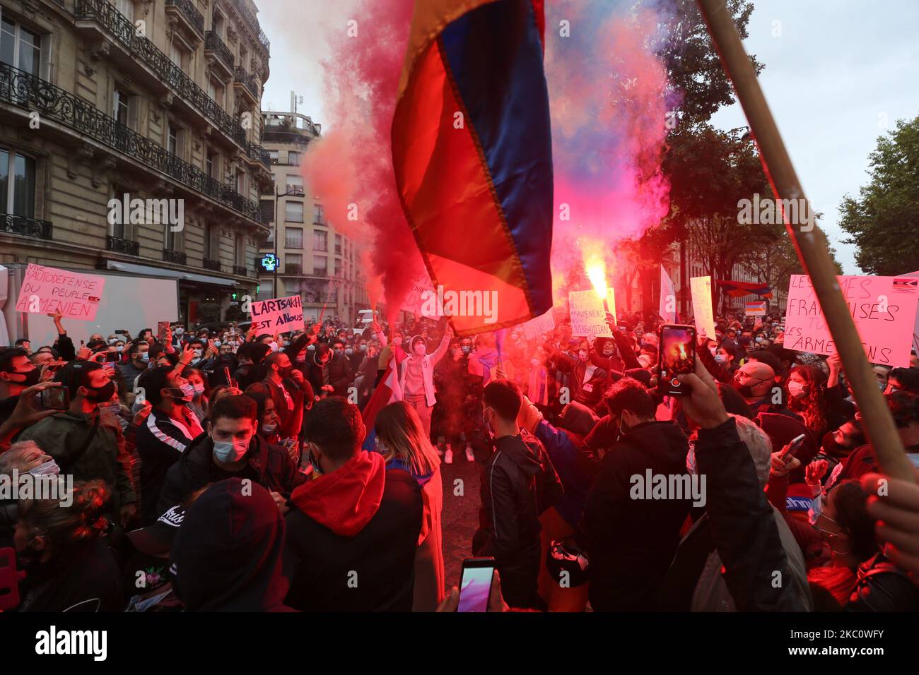 Armenians, carrying smoke bombs and flags in the colors of Armenia take part in a demonstration of Armenians in front of the Azerbaijan ambassy in Paris, France, on September 29, 2020 against the Azerbayan attacks on Nagorno Karabakh. (Photo by Michel Stoupak/NurPhoto) Stock Photo