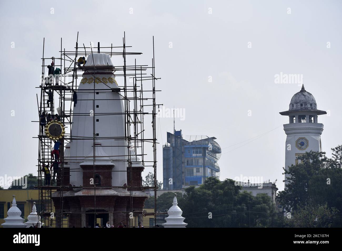 Nepalese people installing pinnacle on the top of Rani Pokhari's Bal Gopaleshwar temple after the reconstruction at Kathmandu, Nepal on Thursday, October 1, 2020. The temple which destroyed during 2015 earthquake and recently rebuilt in the original Malla-era Shikar style. (Photo by Narayan Maharjan/NurPhoto) Stock Photo