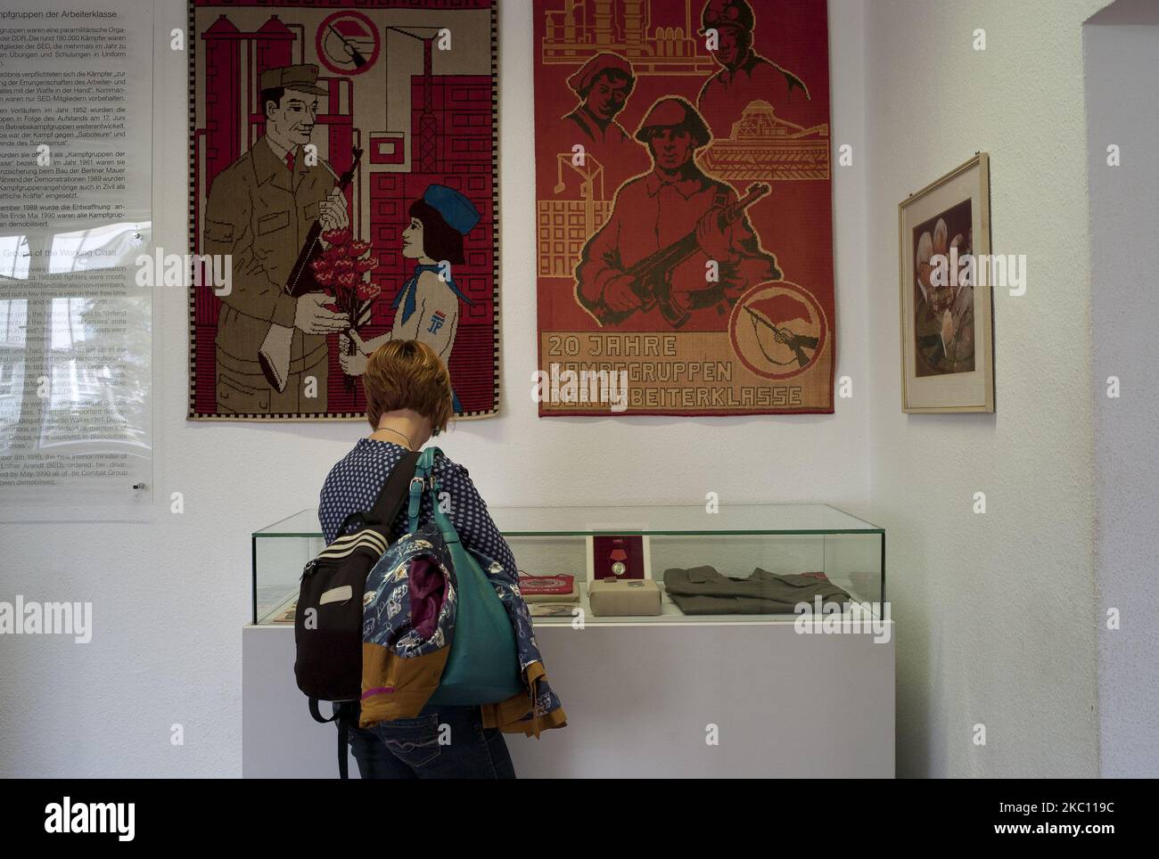 Visitors look at exhibits of Stasi surveillance post to show what