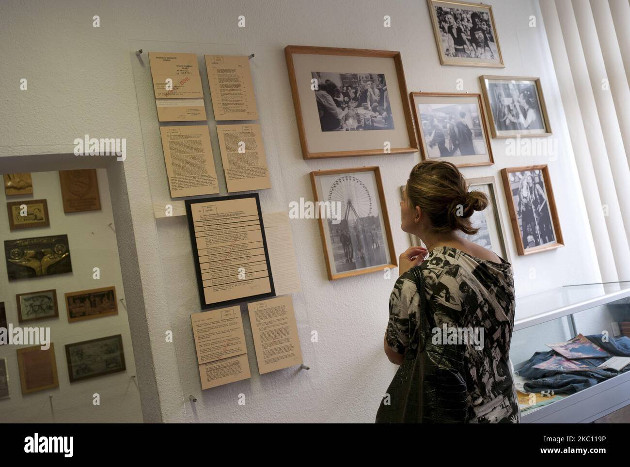 Visitors look at exhibits of Stasi surveillance post to show what