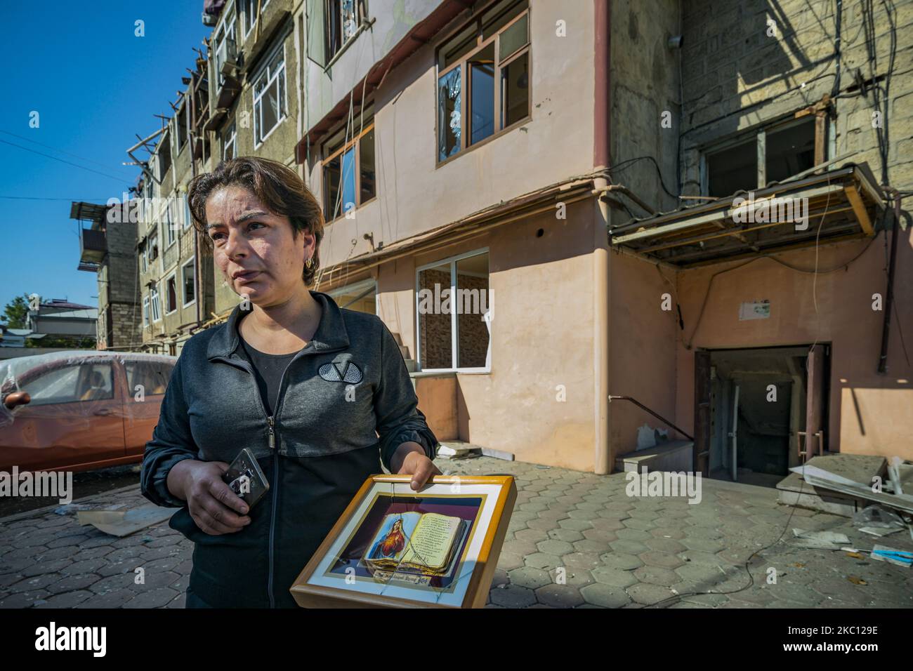 Neighbor of a destroyed building after the impact of an azeri rocket ...