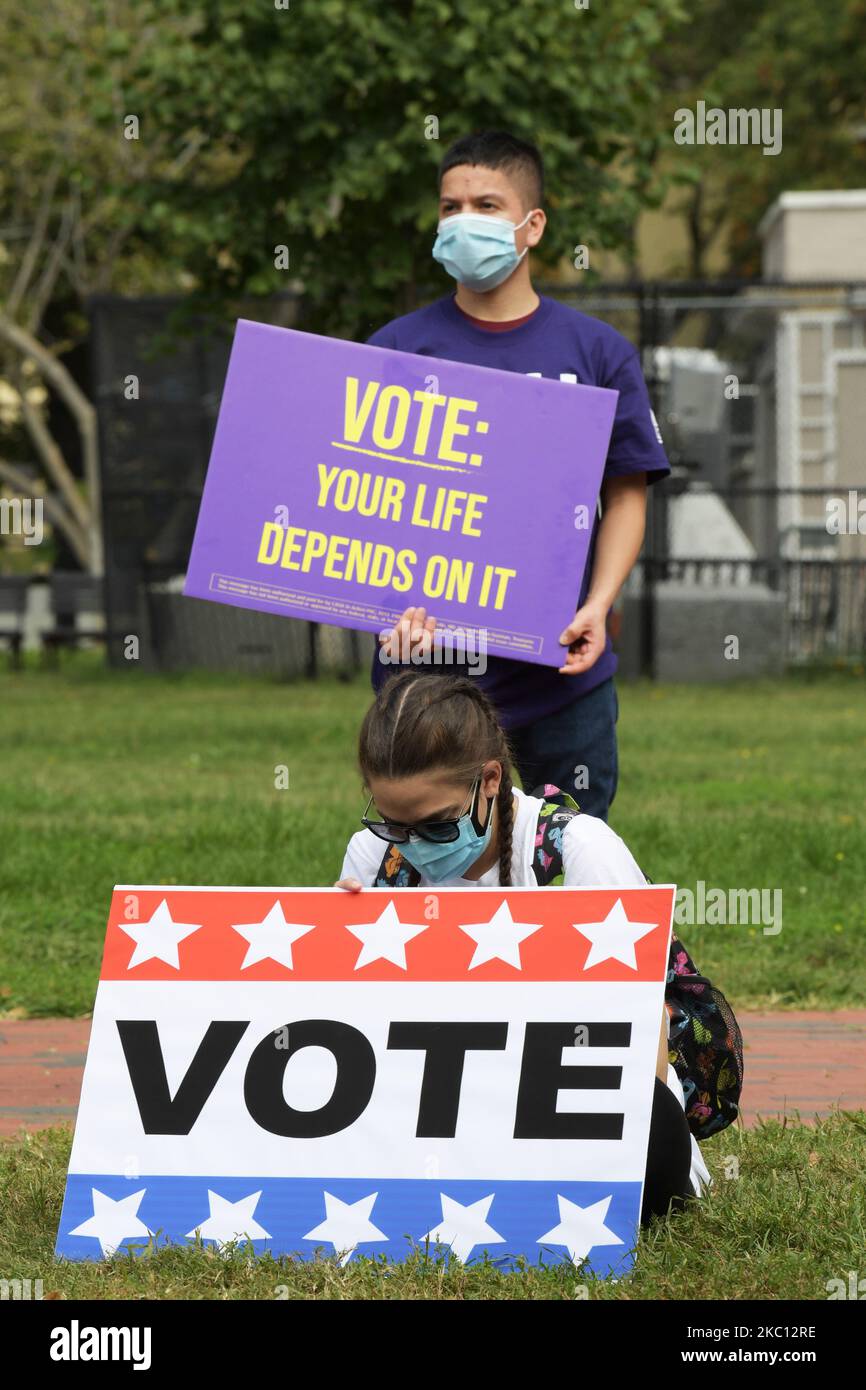 Dozen SEIU(Service Employee International Union) essential worker waring mask and hold a sign protested against President Trump during a rally, today on October 01, 2020 at Lafayette Park in Washington DC, USA. Essential workers are a part of SEIUs largest-ever voter engagement program to expand the electorate by turning out infrequent Black and Latino voters. (Photo by Lenin Nolly/NurPhoto) Stock Photo
