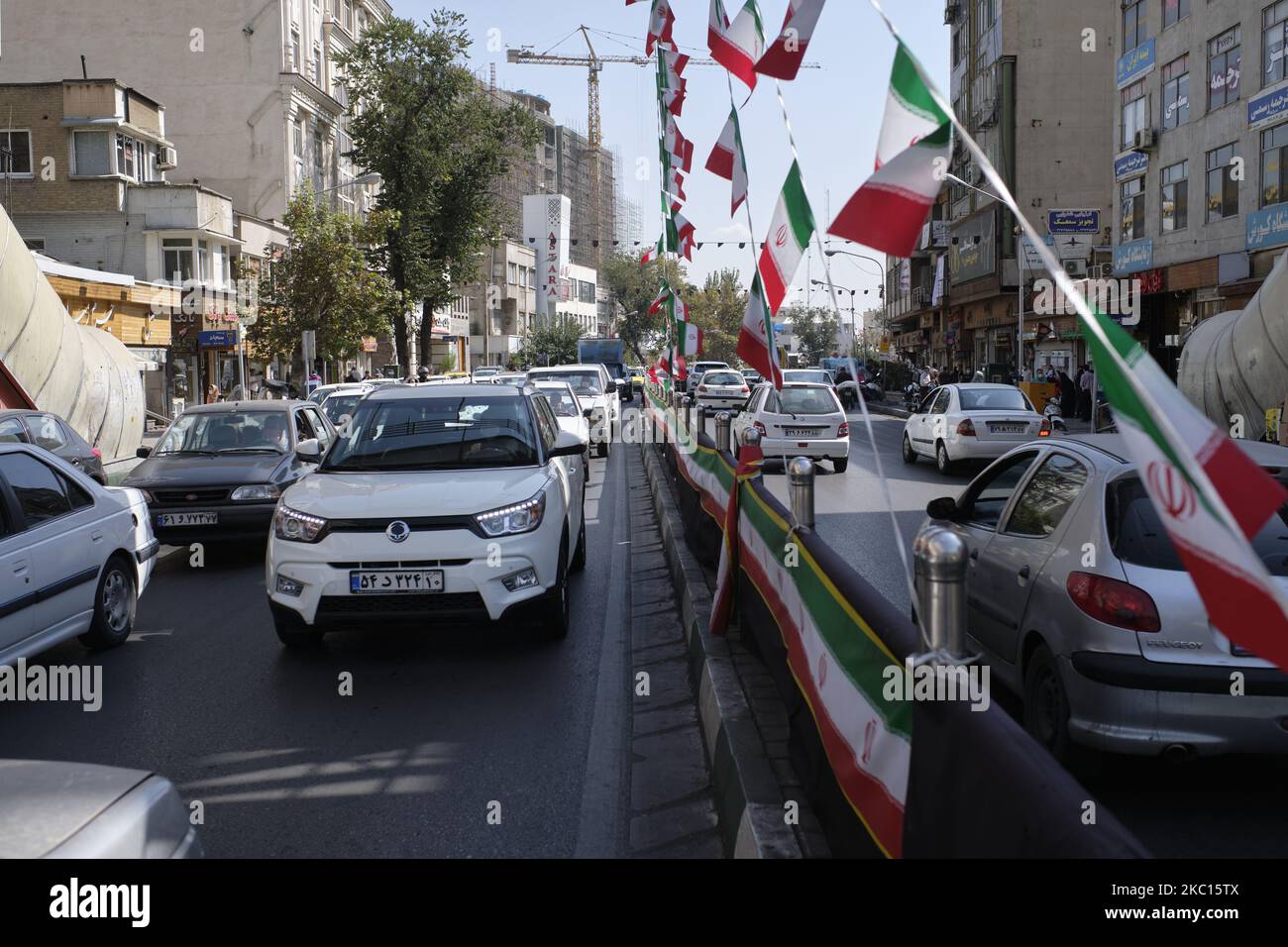 Vehicles drive along an avenue in northern Tehran while the new coronavirus (COVID-19) disease rapid rising in Iran on October 4, 2020. Tehran Governor's office announced on Schools, libraries, mosques, and some other public places such as coffee shops, Holy shrines, and tea houses in Tehran would be closed for a week on Saturday to control the new coronavirus disease outbreak in Tehran but, streets were busy, Mosques and shrines were open, and people seem not to worry about the COVID-19, and Tehran was the same as its days before the virus outbreak. (Photo by Morteza Nikoubazl/NurPhoto) Stock Photo