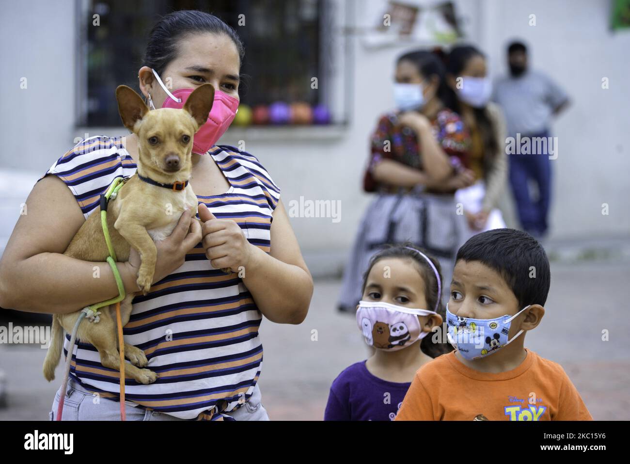 Parishioners take their pets for a blessing on St. Francis of Assisi Day, on October 4, 2020,at St. Julian's Parish in the northern part of Guatemala's capital city. Pastor Luis Alberto Martinez proceeded to sprinkle holy water on the little animals that were waiting with their families. The opening of churches and religious temples by the government since October 1st for the activation of the economy with the health protocols. Guatemala has counted a total of 93,963 positive cases of covid-19 and 3,293 deaths due to the disease, the highest number of deaths in Central America. (Photo by Decci Stock Photo