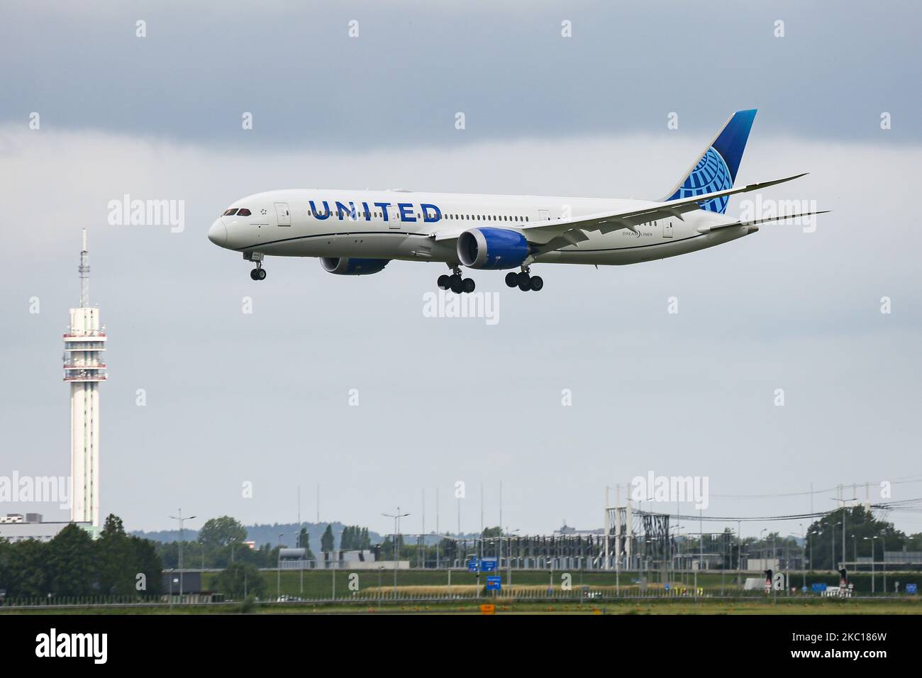 United Airlines Boeing 787-9 Dreamliner aircraft as seen on final approach flying and landing at Polderbaan runway in Amsterdam Schiphol AMS EHAM Airport in the Netherlands, arriving from Newark EWR New York, NY, USA on August 30, 2020. The advanced modern wide body airplane has the new livery paint scheme and the registration N24976 and 2x GE jet engines. United UA UAL is the third largest airline in the world and a member of Star Alliance aviation alliance. United is connecting US with Europe and the Netherlands with Cargo and passenger flight during the Covid-19 Coronavirus Pandemic period. Stock Photo