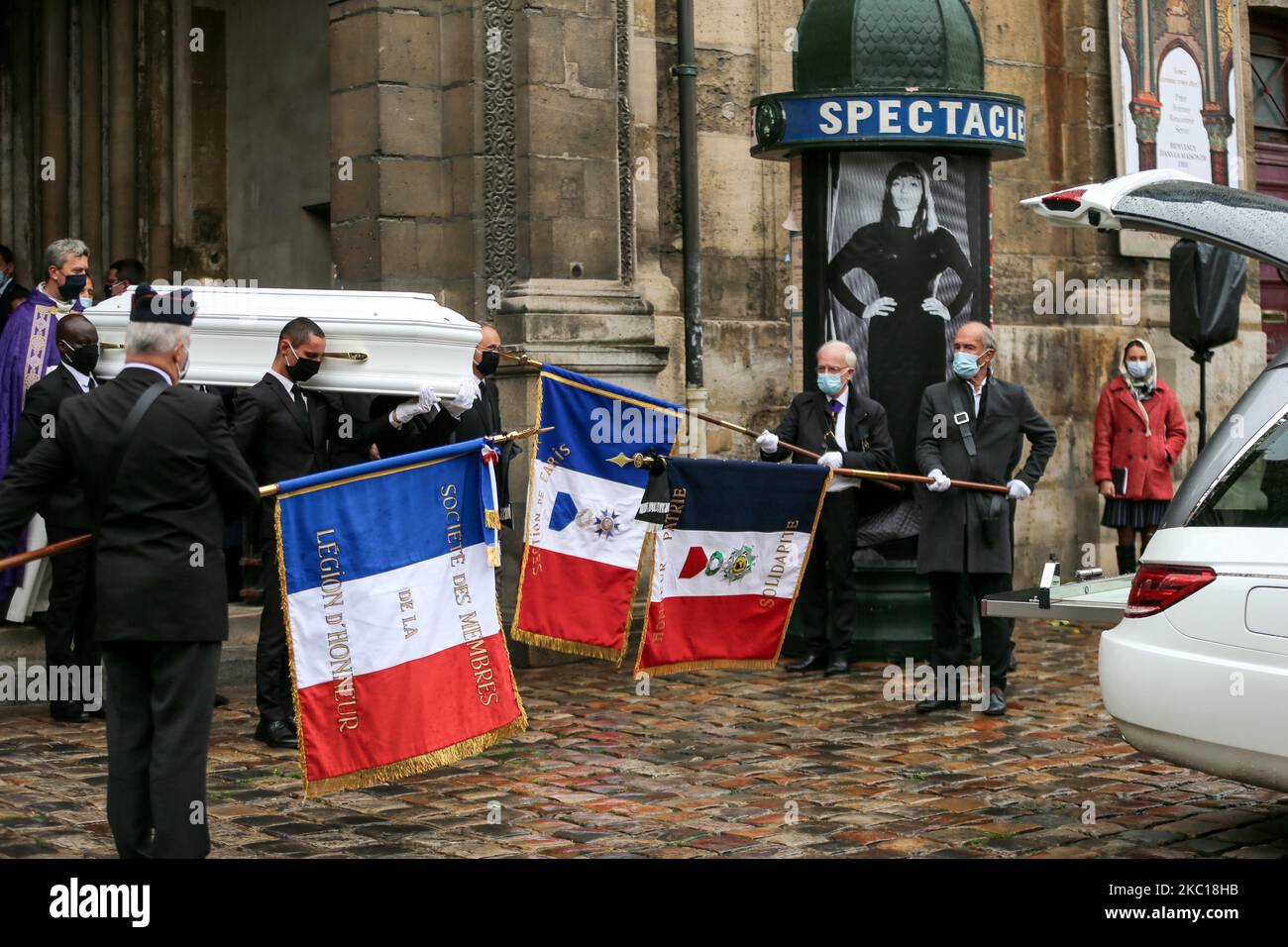 Pallbearers carry out the coffin of French singer Juliette Greco during her funeral ceremony at the Saint-Germain-des-Pres church in Paris, on October 5, 2020. Legendary French singer Juliette Greco, whose career spanned over half a century, died aged 93, on 23 September 23. In the background, a mock-colonne Morris advertising column displays a poster of French singer Juliette Greco. (Photo by Michel Stoupak/NurPhoto) Stock Photo