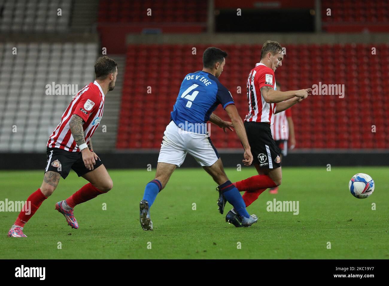 Danny devine of carlisle united challenges jack diamond of sunderland