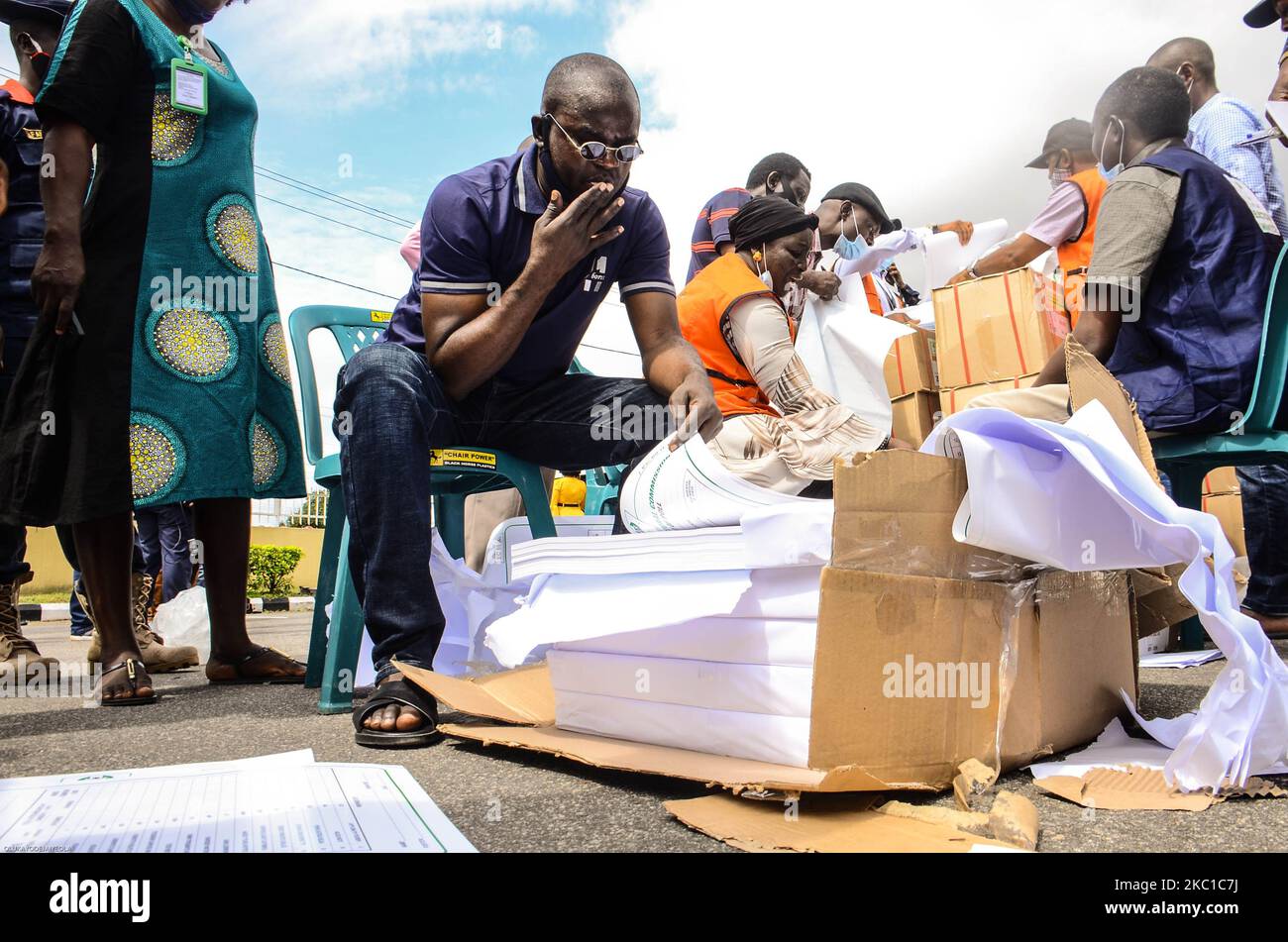 A man taking records of electoral materials, during the distribution of electoral materials to different local government areas at the central Bank of Nigeria in Akure, Ondo State, on October 08, 2020. (Photo by Olukayode Jaiyeola/NurPhoto) Stock Photo