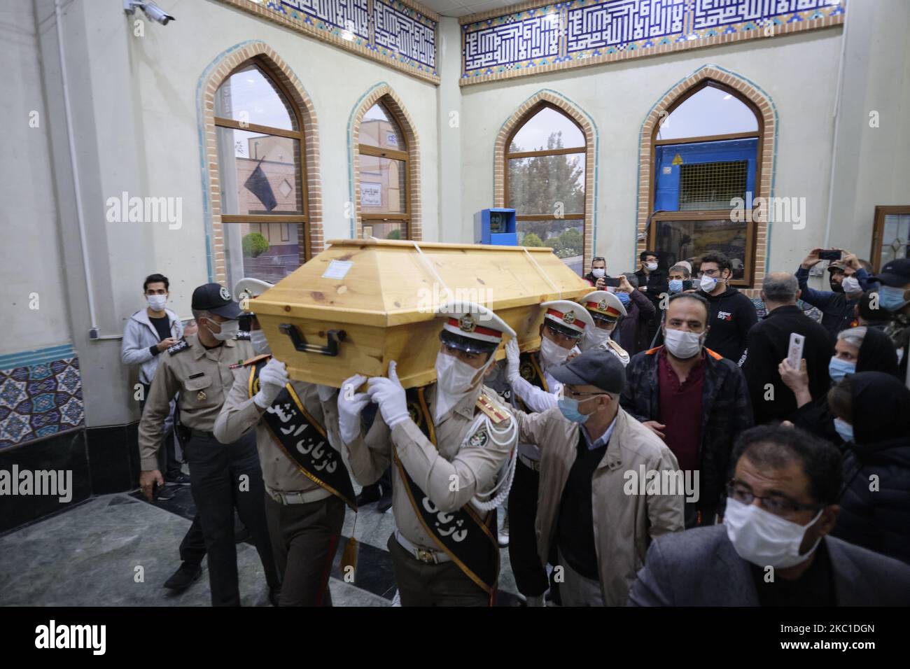 Members of the Iran’s Army honor guard carrying the coffin of the Iranian iconic vocalist master of Persian traditional music, Persian calligrapher and humanitarian activist, Mohammad-Reza Shajarian, during a dead-pray ceremony in Behesht-e-Zahra cemetery in south of Tehran on October 9, 2020. (Photo by Morteza Nikoubazl/NurPhoto) Stock Photo