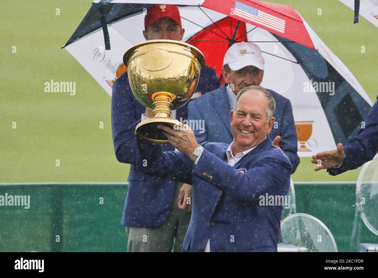 United States Team Captain Jay Haas hold cup trophy with wins ceremony on the podium during the PGA Tour President Cup Single Match at Jack Nicklaus GC in Incheon, South Korea on