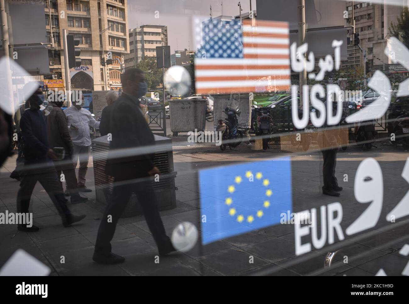 An Iranian man walks past an electronic board displayed at the currency exchange shop in Tehran’s business district on October 10, 2020. U.S. Dollar has risen again. You may see the price under 300,000 IRR for each Dollar on the electronic board displayed at the currency exchange shops, but the real USD price was 300,000 IRR for buy and 3,250,000 IRR for sale on each Dollar, A street money changer told the photographer. (Photo by Morteza Nikoubazl/NurPhoto) Stock Photo