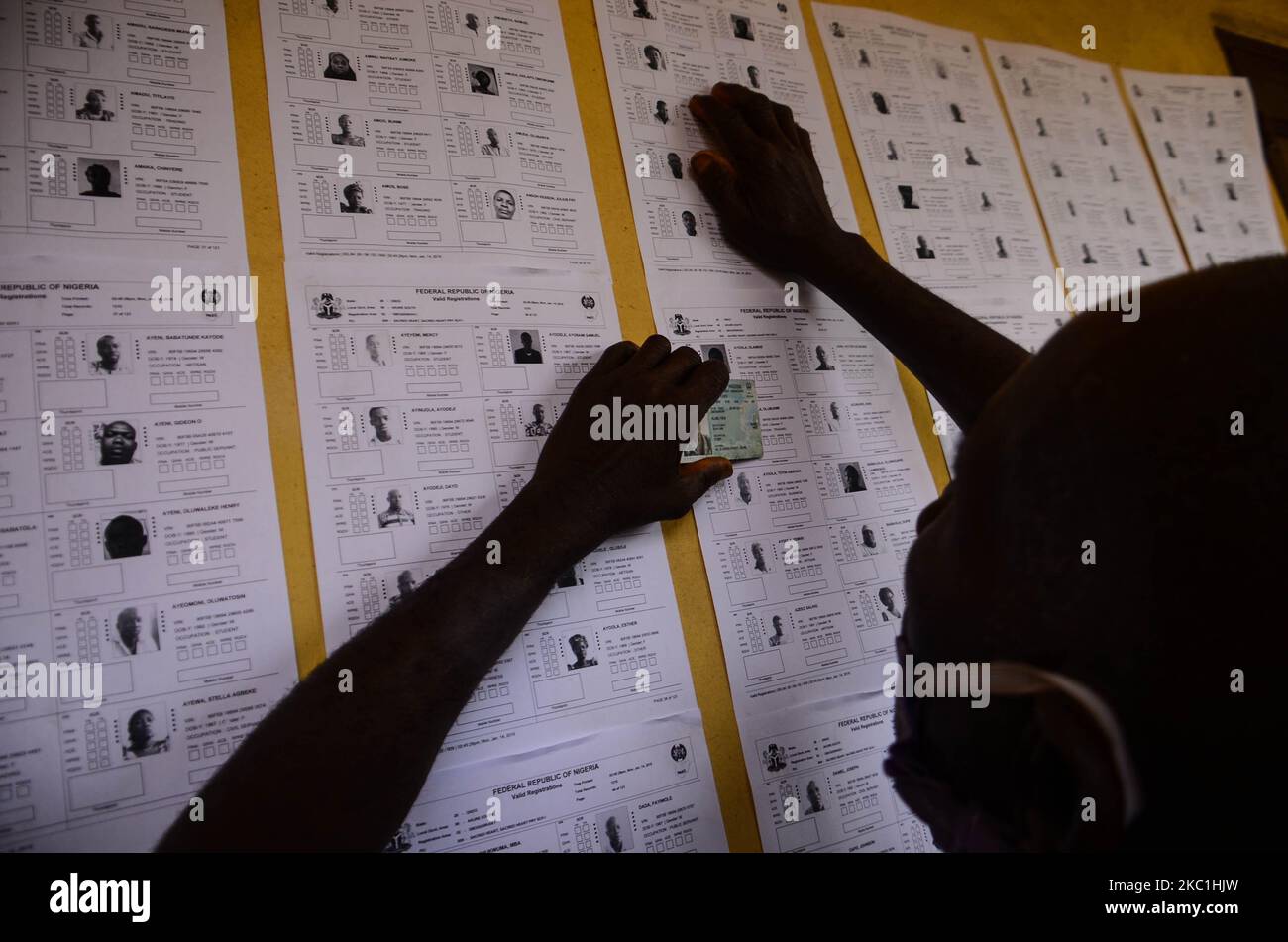 A Voter checks his name on INEC voting list at scared heart primary in schoolGbogi/Isikan, in Akure South Ondo State on October 9, 2020. (Photo by Olukayode Jaiyeola/NurPhoto) Stock Photo