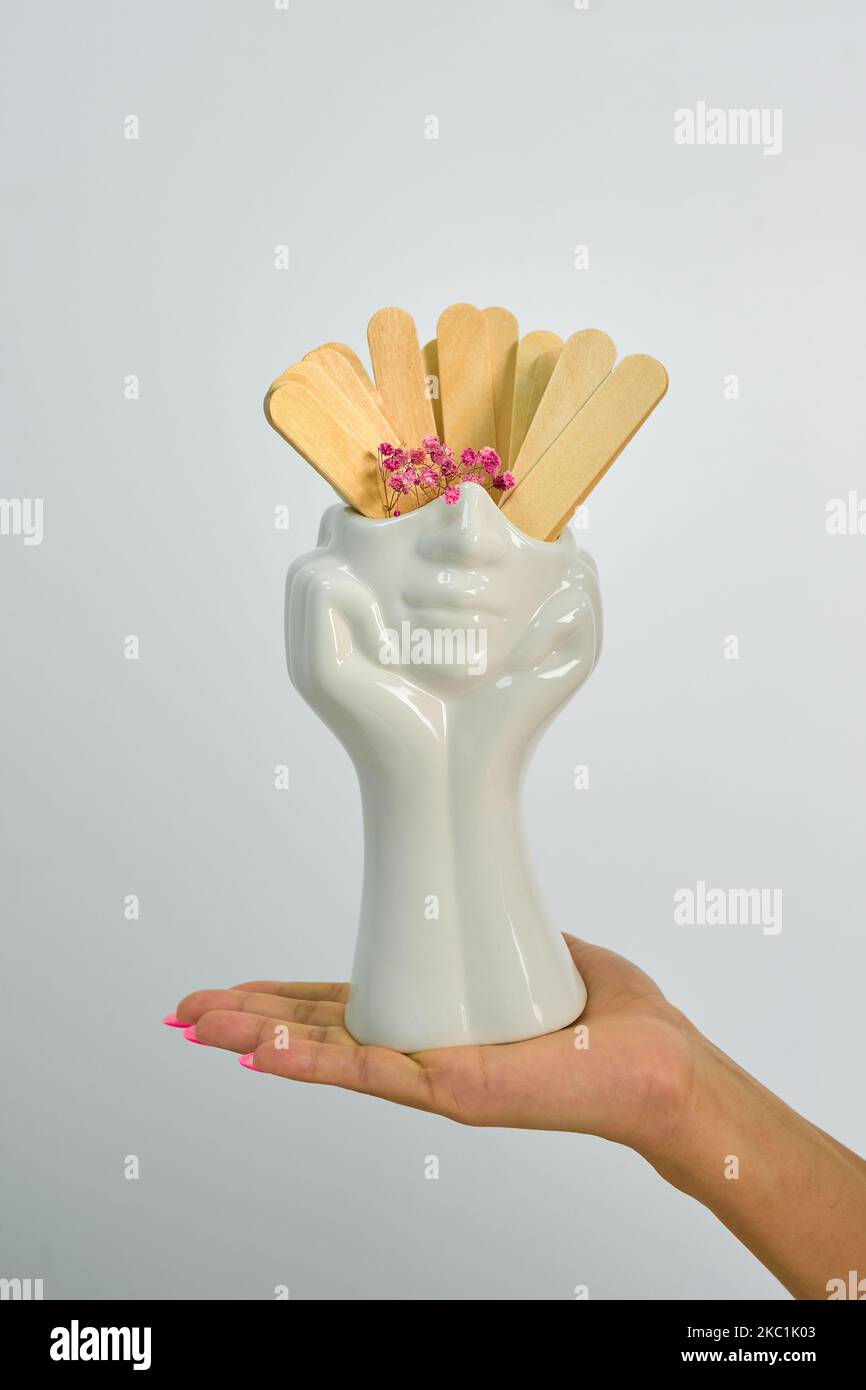 ceramic white vase in hand Stock Photo