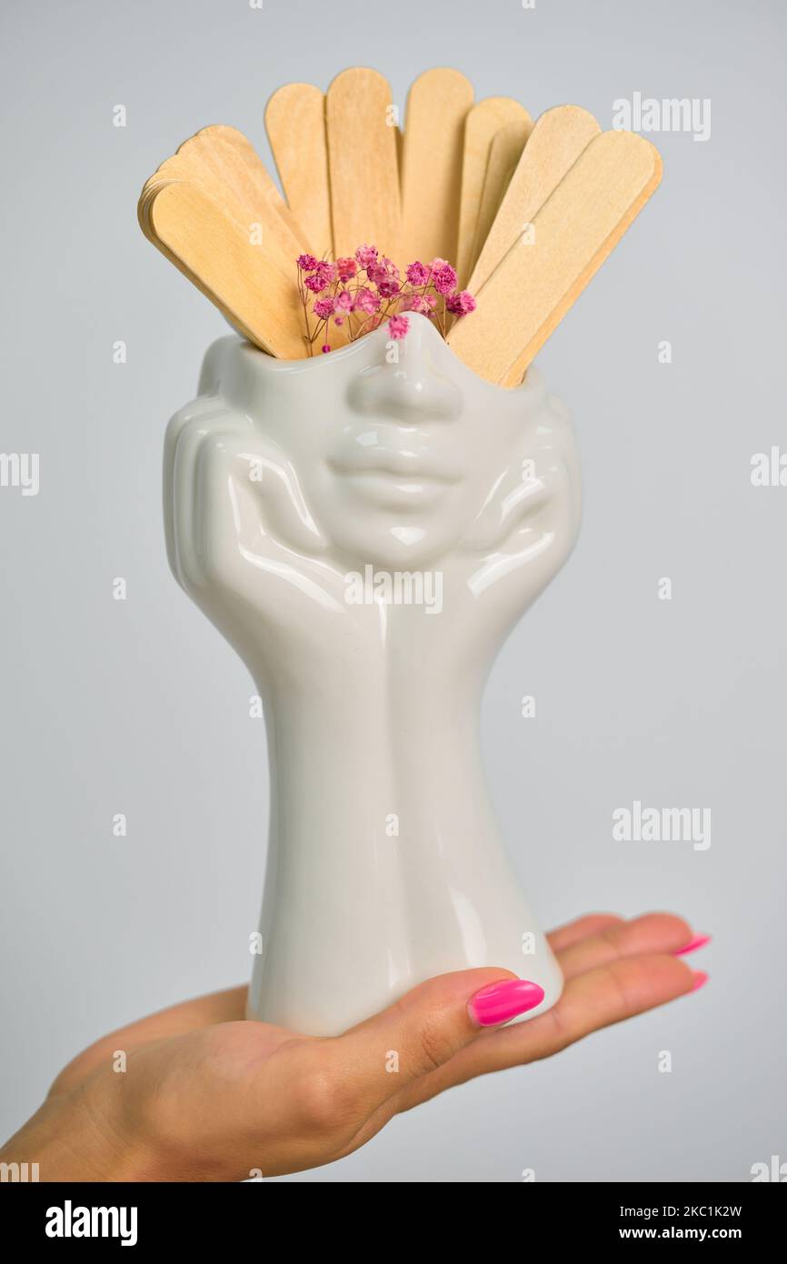 ceramic white vase in hand Stock Photo