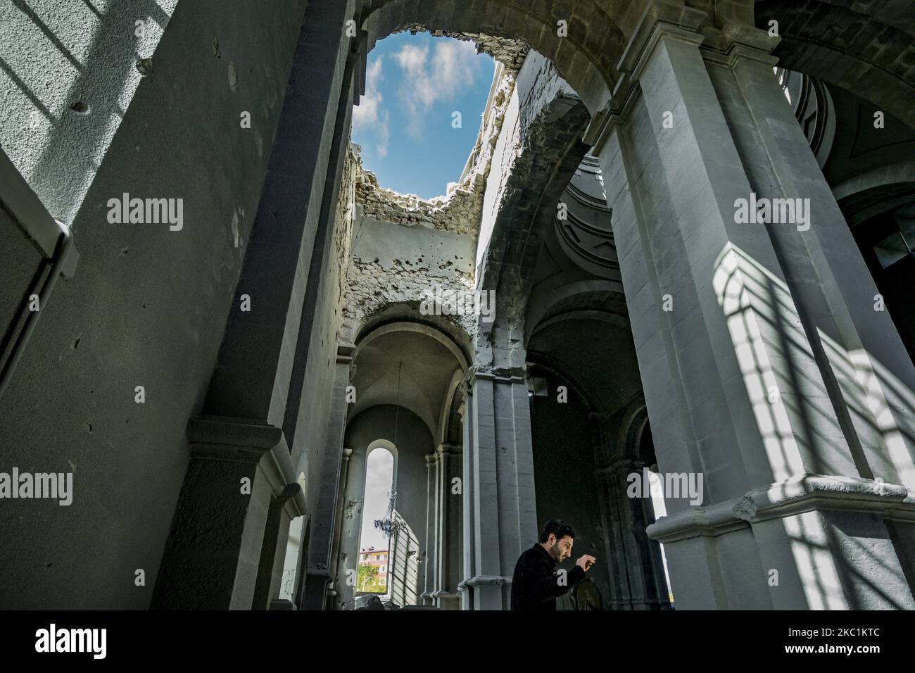 Huge hole in the ceiling of the Ghazanchetsots Cathedral in Shushi, Nagorno Karabakh, after the Azerbaijan shelling in a double attack to the building on October 11, 2020. (Photo by Celestino Arce/NurPhoto) Stock Photo