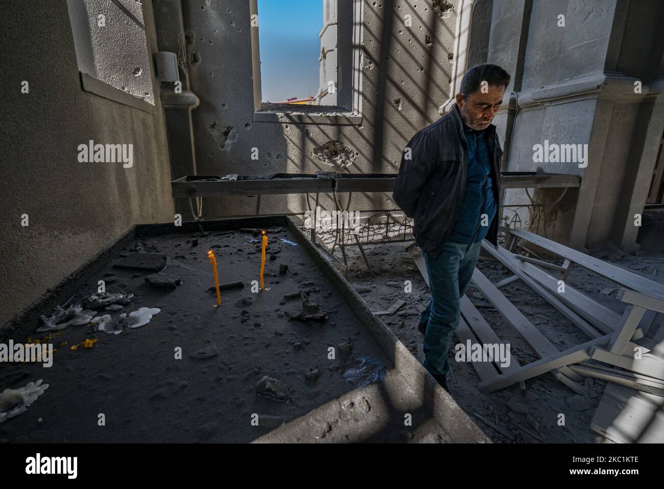 A man walks in the destruction of the Ghazanchetsots Cathedral in Shushi city, Nagorno Karabakh, after the Azerbaijan shelling of the church in a double attack on October 11, 2020. (Photo by Celestino Arce/NurPhoto) Stock Photo