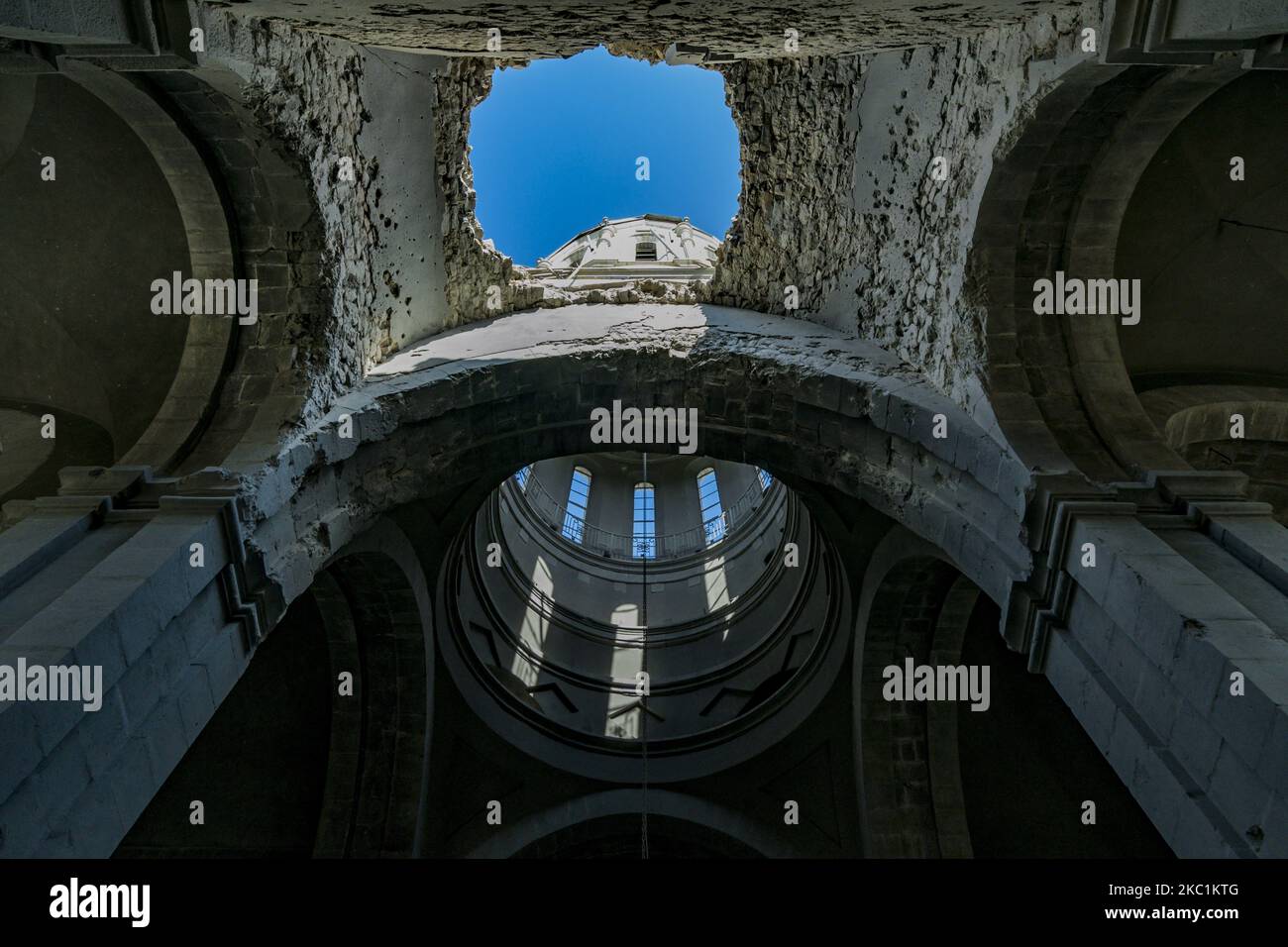 Massive hole in the ceiling of the Ghazanchetsots Cathedral in Shushi, Nagorno Karabakh, after the Azerbaijan shelling in a double attack to the building on October 11, 2020. (Photo by Celestino Arce/NurPhoto) Stock Photo