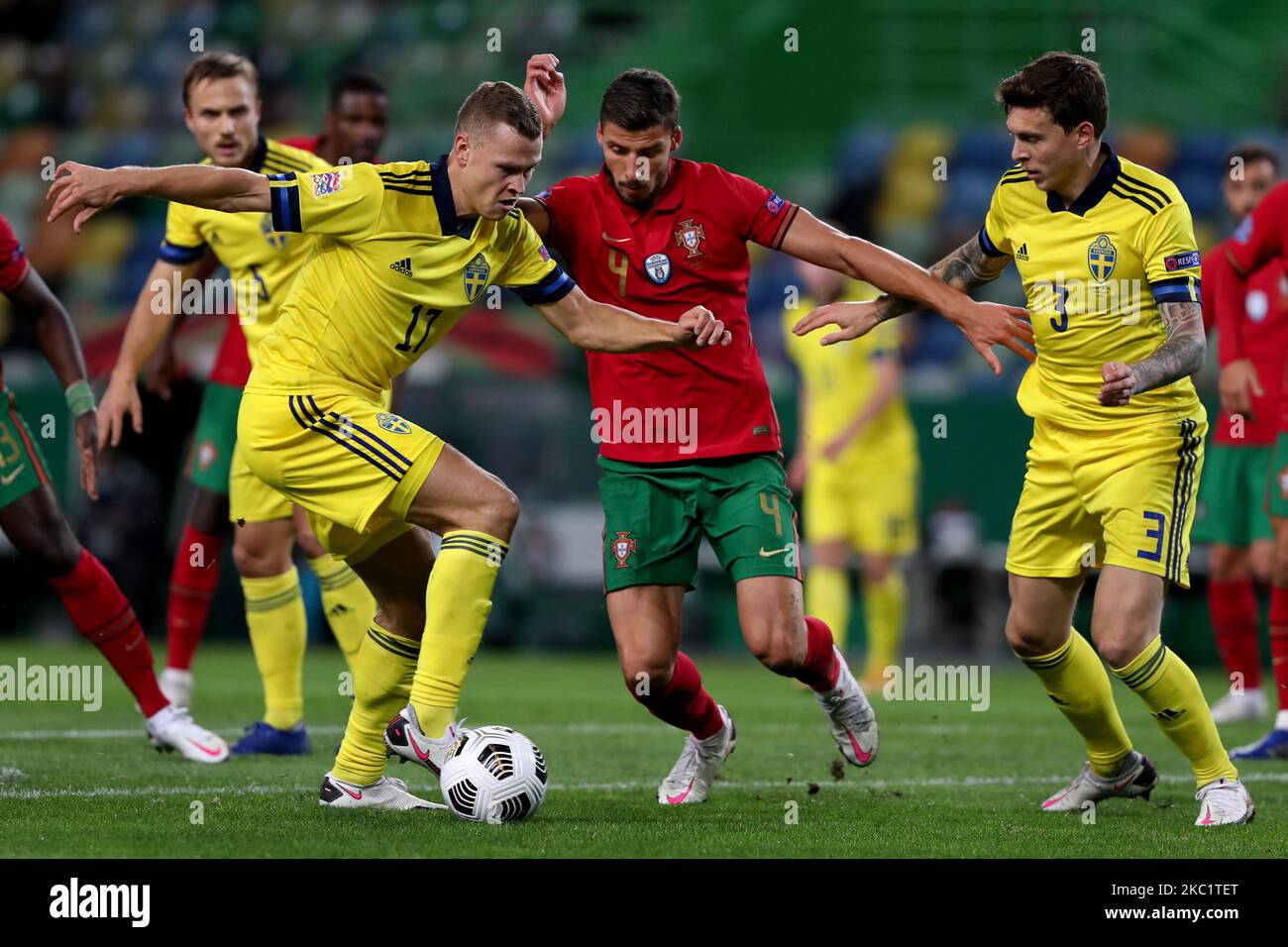 Viktor Claesson of Sweden (L) vies with Ruben Dias of Portugal (C ) during the UEFA Nations League group stage match between Portugal and Sweden, at the Jose Alvalade stadium in Lisbon, Portugal, on October 14, 2020. (Photo by Pedro FiÃºza/NurPhoto) Stock Photo