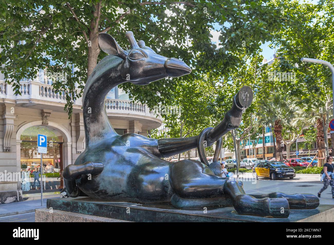 BARSELONA, SPAIN - MAY 12, 2017: Sculpture Resting Giraffe is a figure of a giraffe lying in a resting flirtatious pose on the boulevard in the center Stock Photo