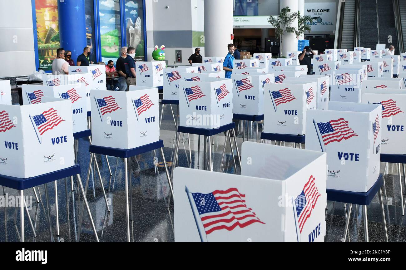 Election workers set up voting booths at an early voting site established by the City of Orlando and the Orlando Magic at the Amway Center, the home arena of the Magic, on October 15, 2020 in Orlando, Florida. Early voting begins in Florida on October 19, 2020. (Photo by Paul Hennessy/NurPhoto) Stock Photo