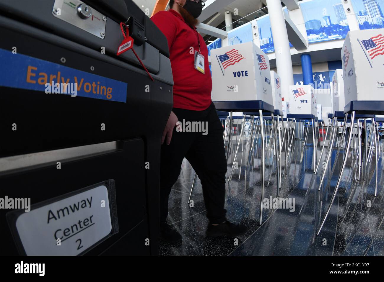 A tabulation machine and voting booths are seen during the set up of an early voting site established by the City of Orlando and the Orlando Magic at the Amway Center, the home arena of the Magic, on October 15, 2020 in Orlando, Florida. Early voting begins in Florida on October 19, 2020. (Photo by Paul Hennessy/NurPhoto) Stock Photo