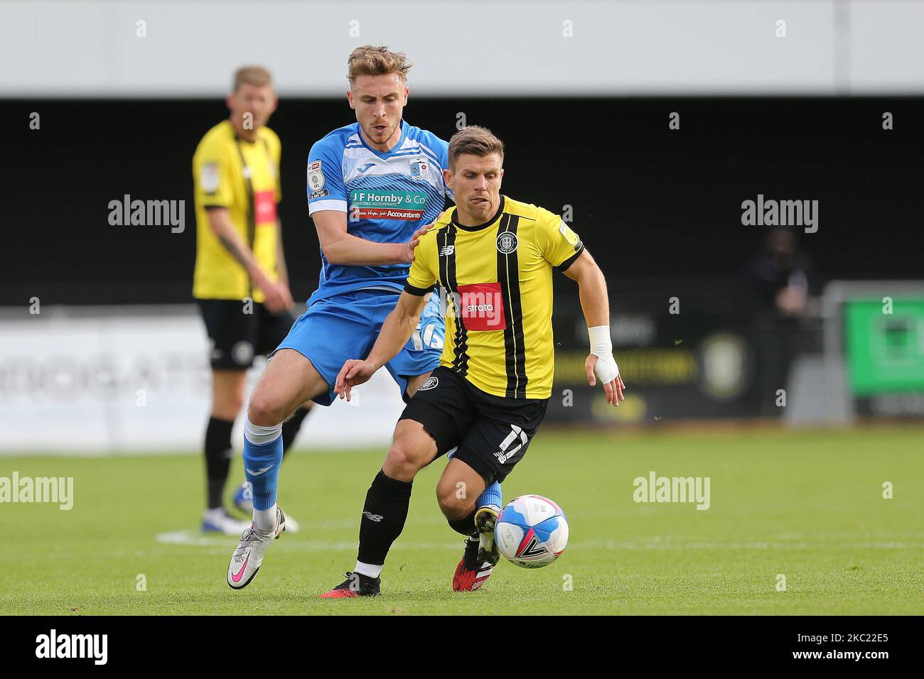 Tom Beadling of Barrow in action with Lloyd Kerry of Harrogate Town during the Sky Bet League 2 match between Harrogate Town and Barrow at Wetherby Road, Harrogate, England on 17th October 2020. (Photo by Mark Fletcher/MI News/NurPhoto) Stock Photo
