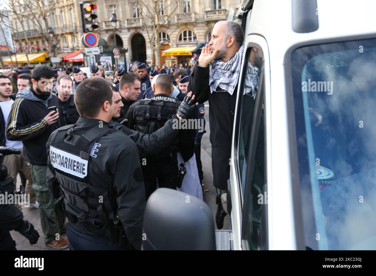 This picture taken on December 29, 2012, in Paris, shows the President of the Cheikh Yassine collective Abdelhakim Sefrioui (C with a white djellaba) being arrested by French anti-riot gendarmes after a protest to support Palestine. Abdelhakim Sefrioui is involved in the France teacher attack near the College du Bois d'Aulne, in the town of Conflans-Sainte-Honorine, some 30km (20 miles) north-west of central Paris, on october 16, 2020. The number arrested rose to 11 on october 18, with police investigating possible links to Islamic extremism. (Photo by Michel Stoupak/NurPhoto) Stock Photo