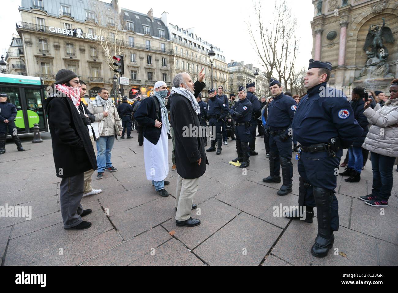 This picture taken on December 29, 2012, in Paris, shows the President of the Cheikh Yassine collective Abdelhakim Sefrioui (C with a white djellaba) protesting in front of French anti-riot gendarmes to support Palestine. Abdelhakim Sefrioui is involved in the France teacher attack near the College du Bois d'Aulne, in the town of Conflans-Sainte-Honorine, some 30km (20 miles) north-west of central Paris, on october 16, 2020. The number arrested rose to 11 on october 18, with police investigating possible links to Islamic extremism. (Photo by Michel Stoupak/NurPhoto) Stock Photo