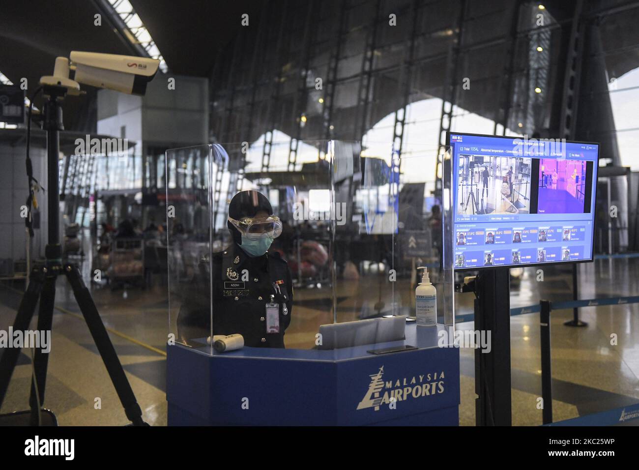 Police officers stand guard at the thermal screening point entrance inside Kuala Lumpur International Airport (KLIA), amid the coronavirus disease (COVID-19) outbreak in Selangor, Malaysia, on 19 October 2020. (Photo by Mat Zain/NurPhoto) Stock Photo