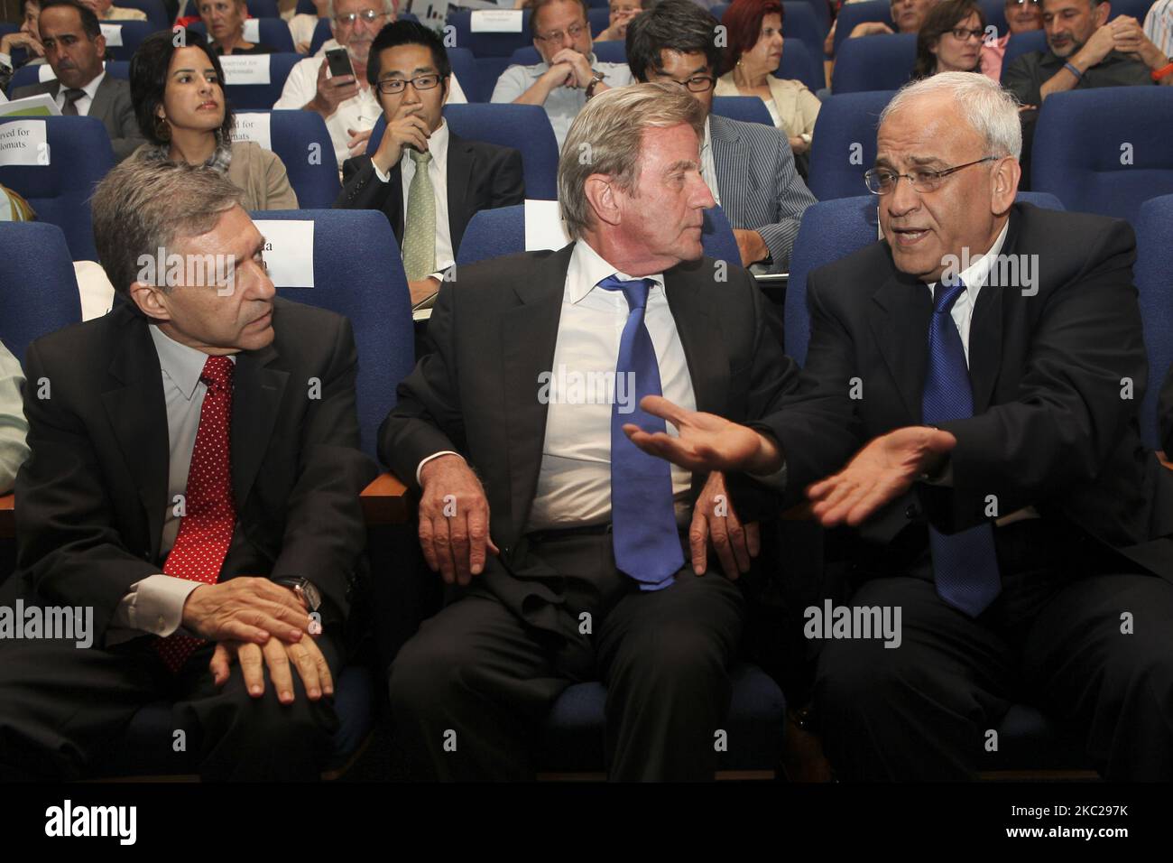 Senior Palestinian politician and diplomat and top PLO official Saeb Erekat (right) talking with former Israeli government minister Yossi Beilin (left) and former French foreign minister and co-founder of Médecins Sans Frontières Bernard Kouchner (center) at a conference organized by the Geneva Initiative organization in Tel Aviv, Israel, on 16 May, 2011. Senior Palestinian politician and diplomat and top PLO official Saeb Erekat is in critical condition with COVID-19 after he was hospitalized at Israel's Hadassah Medical Center in Jerusalem on Sunday, 18 October, 2020. (Photo by Mati Milstein Stock Photo