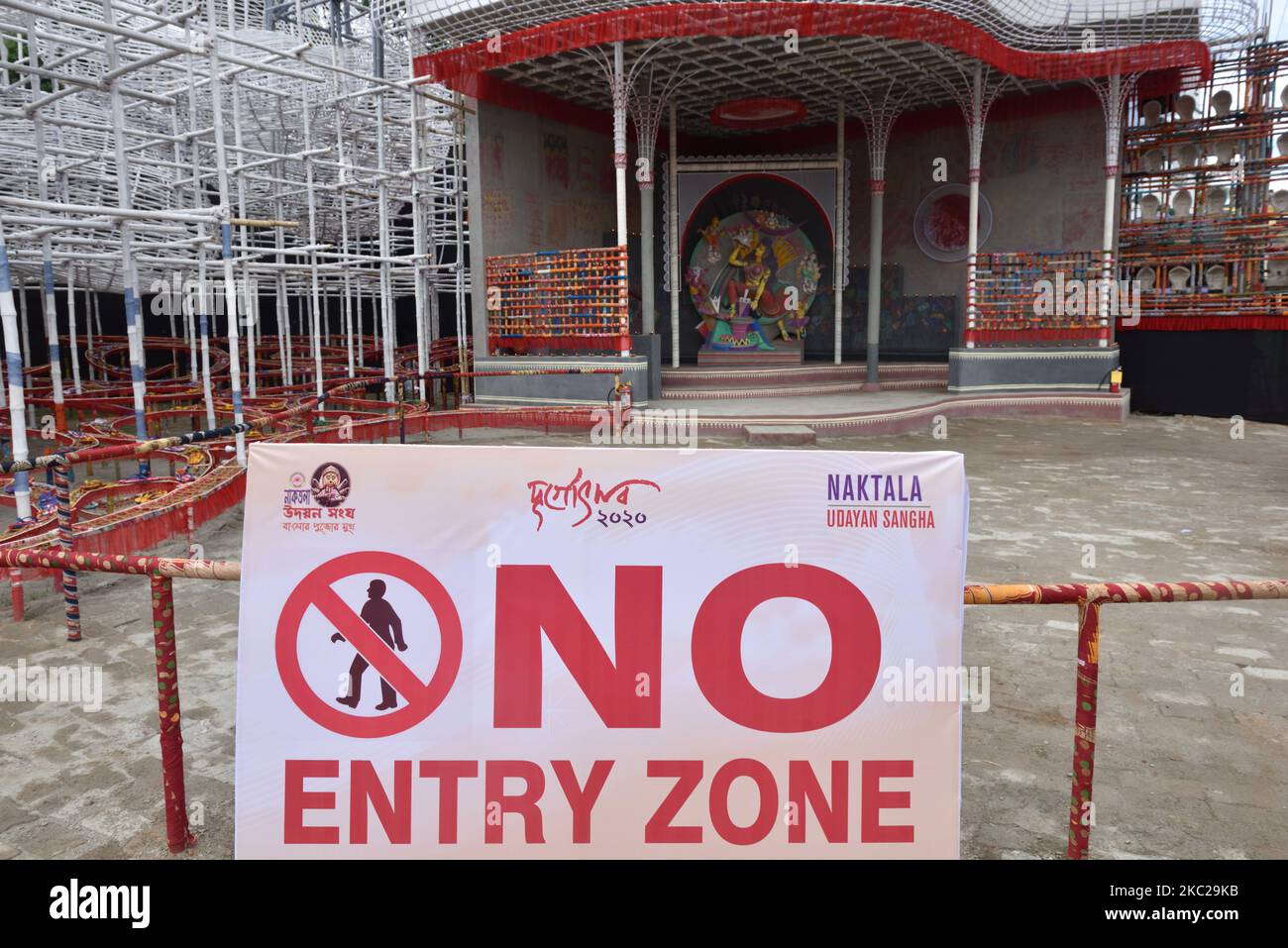 â€œNo Entryâ€ notice as per direction given by the Calcutta High Court, on October 21, 2020 in Kolkata, India. As The Calcutta High Court on Monday ordered due to the fears of Covid-19 spread cases in West Bengal declared Durga Puja pandals(temporary makeshift) would be a no entry and containment zones for visitors and pandal hoppers. The High Court also ordered visitors would not be allowed within a radius of five metres distance for small pandals and ten metres for big pandals and directed organizers to add barricades at pandals(temporary makeshift) entrance. (Photo by Sukhomoy Sen/NurPhoto Stock Photo