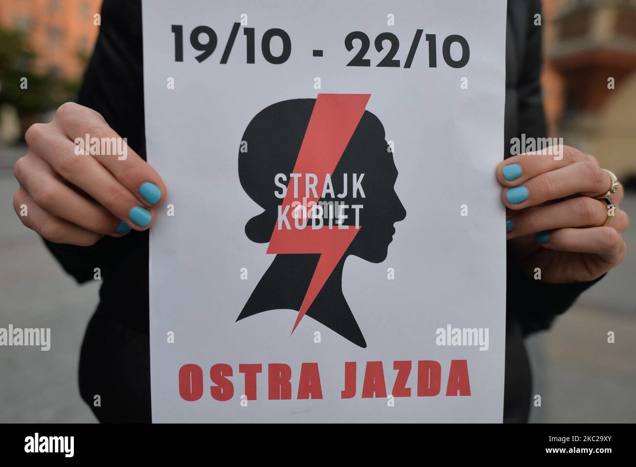 Pro-Choice activist with a logo of the 'Women Strike', seen in the center of Krakow, part of the Coronavirus Red Zone, during a protest against a proposed law that prohibits abortion for irreversible damage to the fetus. Tomorrow, on Thursday, October 22, the Constitutional Tribunal is to consider the motion of a group of PiS (Law and Justice rulling party) deputies regarding the constitutionality of the so-called Eugenic abortion, performed in case of suspicion of a child's disease or its impairment. A group of PiS MPs submitted an application to the Constitutional Tribunal. On October 21, 20 Stock Photo