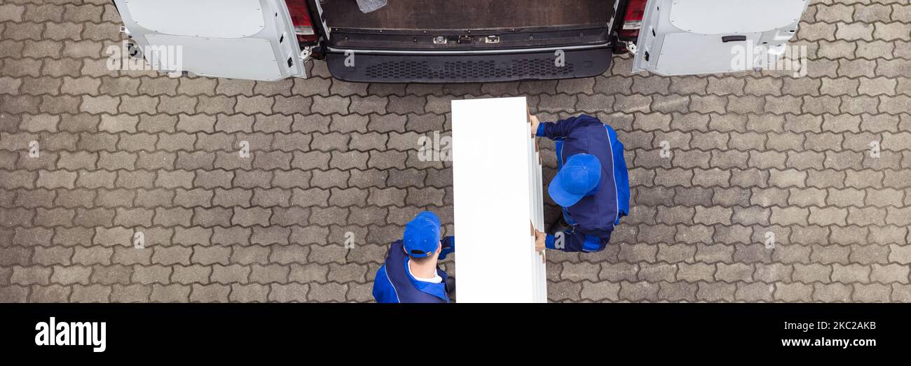 Furniture Transport Truck Service. Movers Unloading Delivery Van Stock