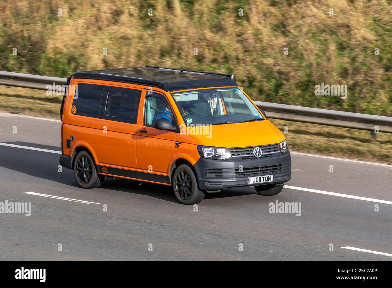 2016 VW Volkswagen Transporter T28 Stln Tdi Bmt A Orange; travelling on the M6 motorway, UK Stock Photo