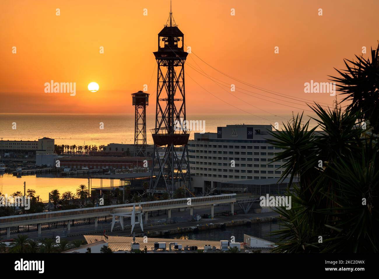 Port Vell (the Old Harbor) and Jaume I tower in Barcelona at sunrise (Barcelona, Catalonia, Spain) ESP: Port Vell (puerto viejo) y Torre Jaume I, BCN Stock Photo