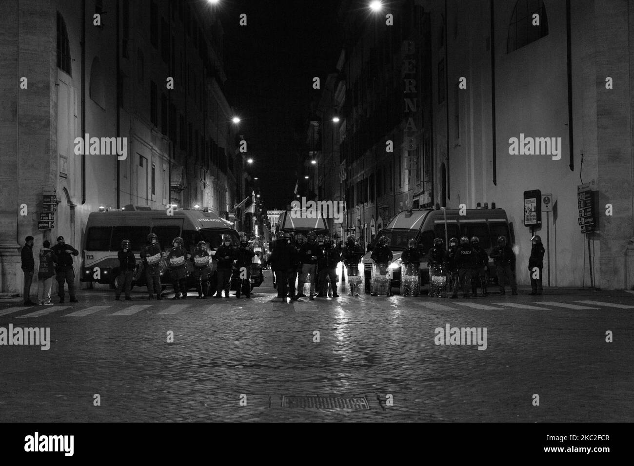 (EDITOR'S NOTE: Image was converted to black and white) The anti-riot police during urban Guerrilla during the far-right demostration at Piazza Del Popolo in Rome, Italy, on October 24, 2020 between the protesters and the police. The demostration was organized by the political party Forza Nuova to protest against the Italian Government and the new restrictions. (Photo by Matteo Trevisan/NurPhoto) Stock Photo