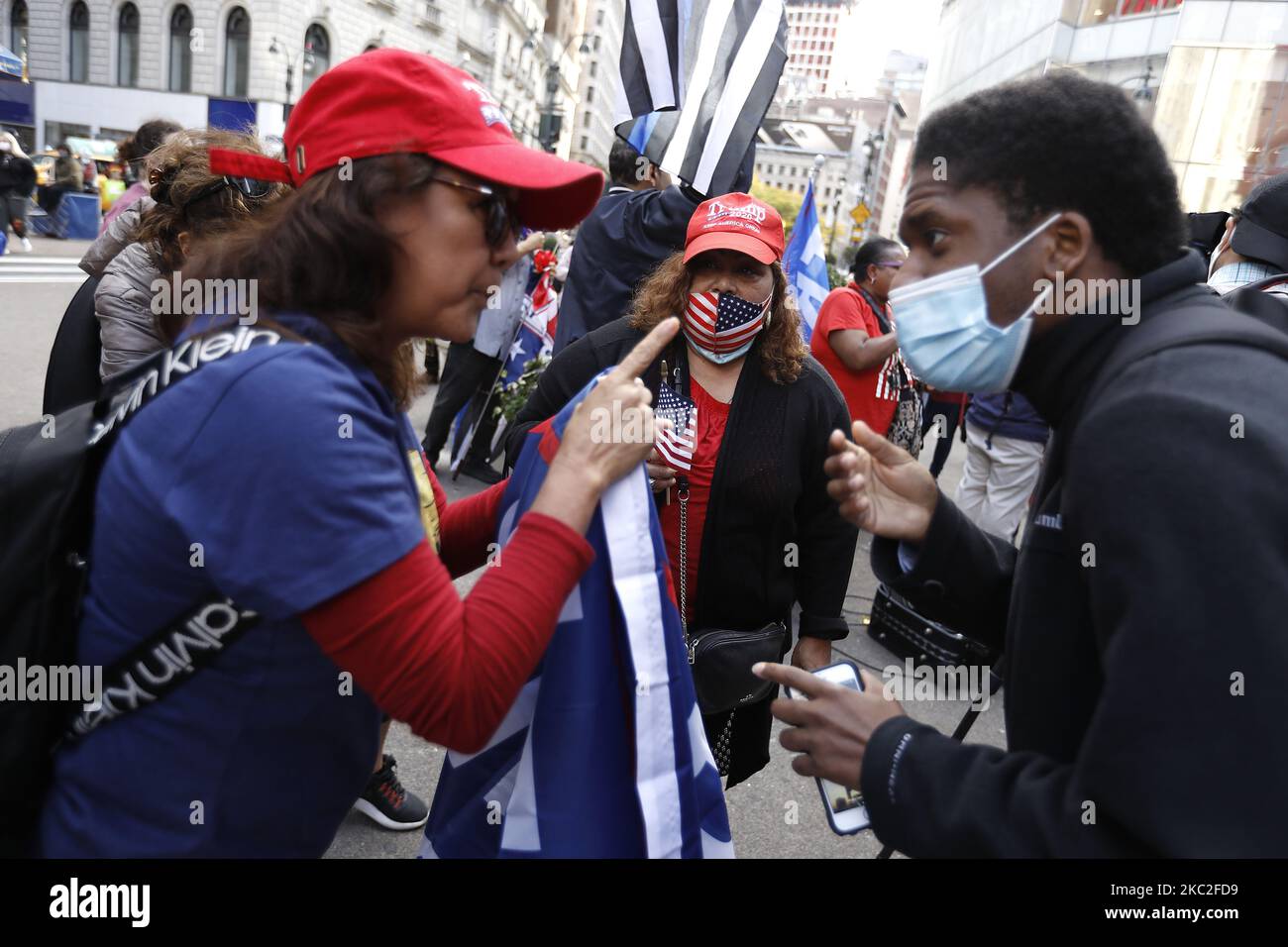 Supporters of President Trump clash with supporters of Joe Biden in Herald Square on October 24, 2020 in New York City. With the November 3rd Election Day fast approaching, tensions and verbal confrontations were heard from both party voters as they yelled slogans across 34th Street. (Photo by John Lamparski/NurPhoto) Stock Photo