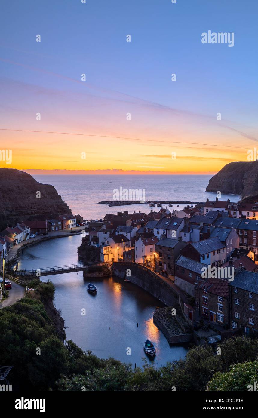 Dawn breaking over Staithes Harbour North Yorkshire England Stock Photo