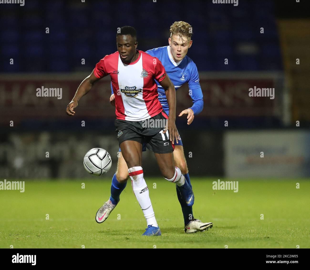 Hartepool, County Durham, UK. 27th Oct 2020. Lewis Cass of Hartlepool United  in action with Altrincham's Yusifu Ceesay during the Vanarama National  League match between Hartlepool United and Altrincham at Victoria Park