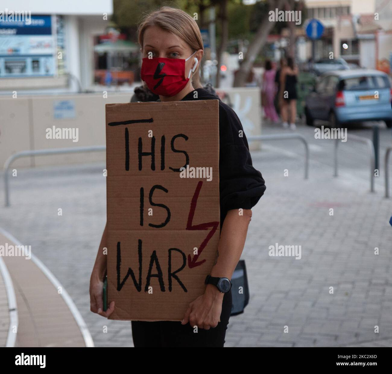 Woman wearing protective mask, holding placard, front of Poland Embassy, in Nicosia, Cyprus, on 29 October 2020. Last week, Poland became the only European Union country to remove a right to legal abortion from its citizens. The country’s top court ruled last Thursday that it was unconstitutional to abort a foetus if it had congenital defects. Poland’s constitution calls for protecting the life of every individual. (Photo by George Christophorou/NurPhoto) Stock Photo