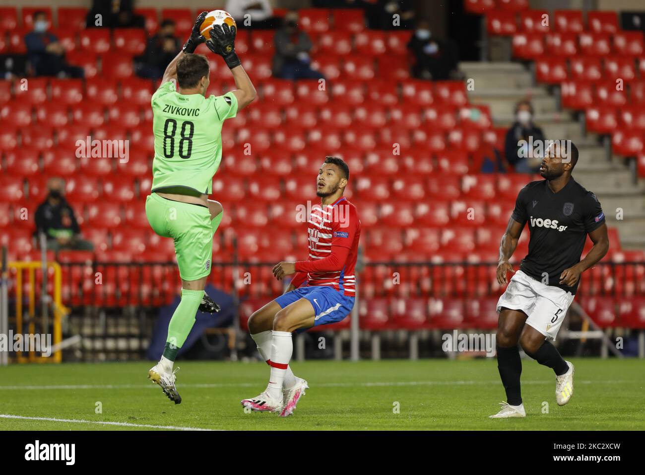 Zivko Zivkovic and Fernando Lopes dos Santos, of PAOK FC defend against Luis Suarez, of Granada CF during the UEFA Europa League Group E stage match between Granada CF and PAOK FC at Estadio Nuevo Los Carmenes on October 29, 2020 in Granada, Spain. Football stadiums across Europe remain closed to fans due to the Coronavirus Pandemic. (Photo by Álex Cámara/NurPhoto) Stock Photo