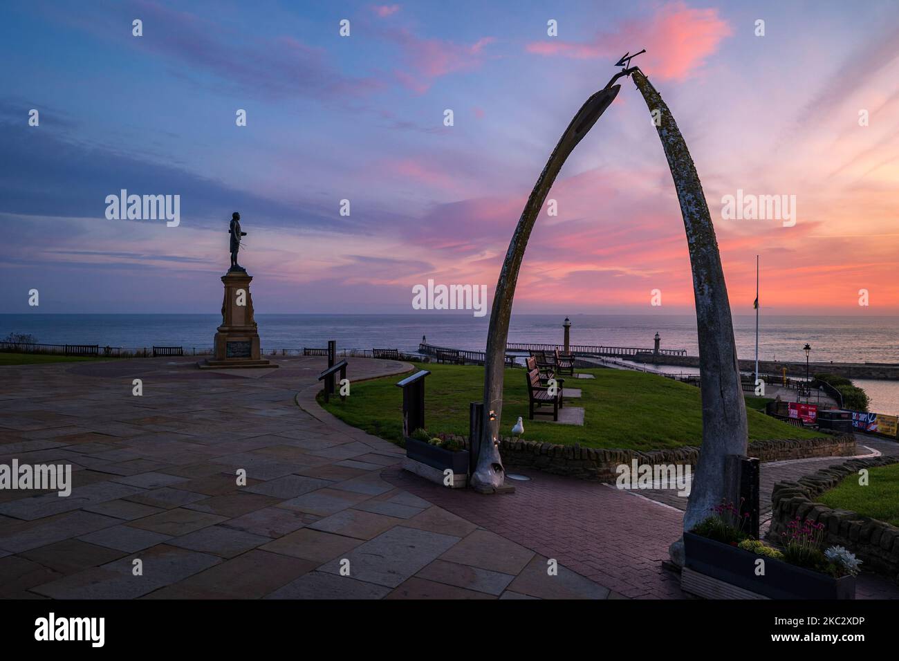 The Whalebone Arch and Captain Cook memorial Statue Whitby North Yorkshire England at sunrise Stock Photo