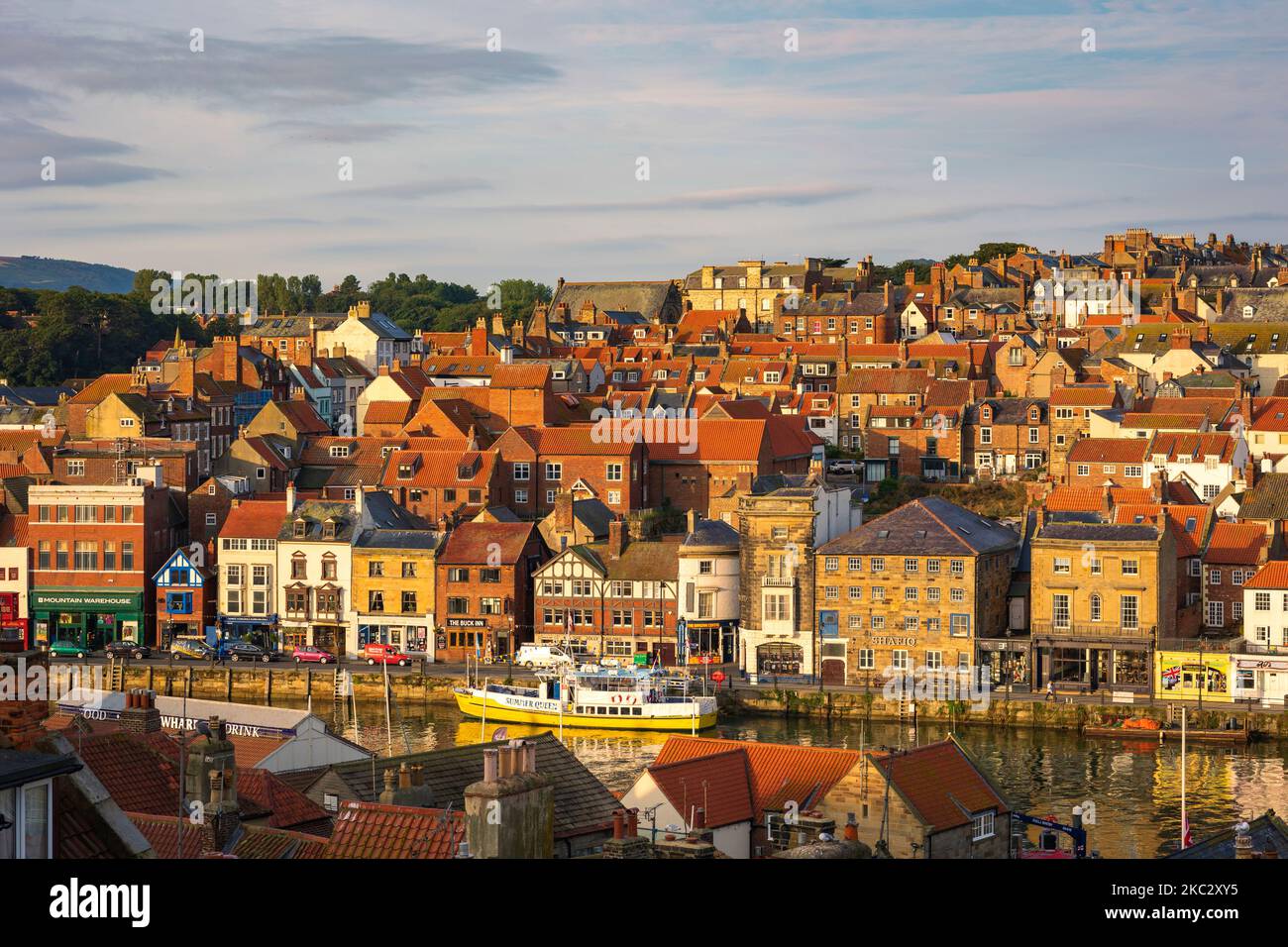 Boats moored on River Esk Whitby North Yorkshire England in morning light Stock Photo