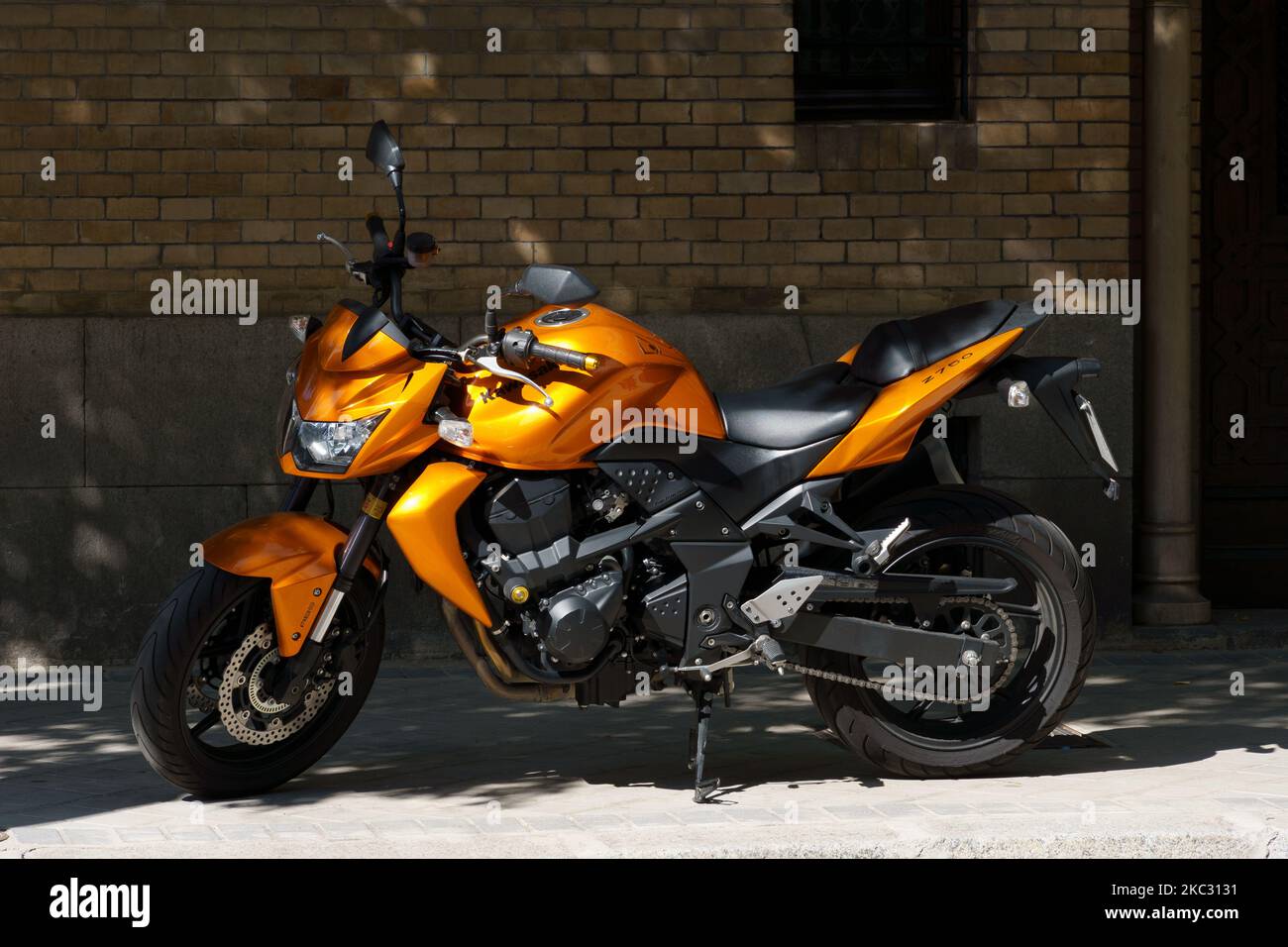 Madrid, Spain - September 24, 2022: Parked orange motorcycle of Kawasaki Z750 Stock Photo