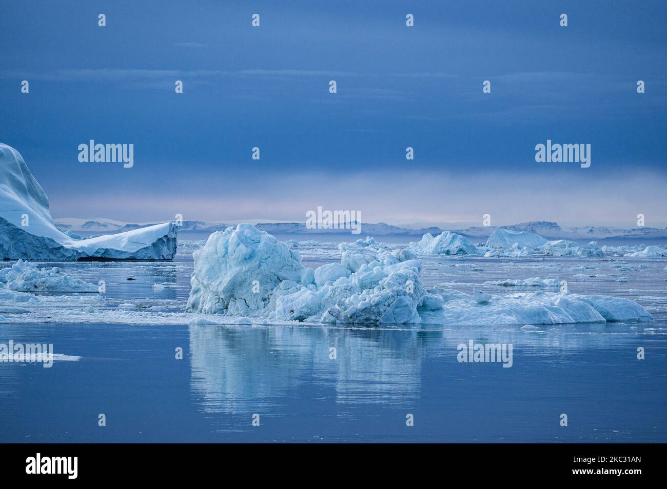 Icebergs near Ilulissat, Greenland. Climate change is having a profound ...
