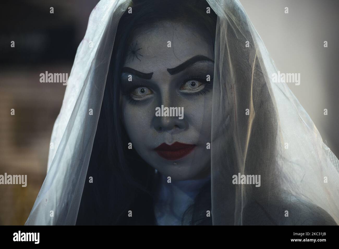 Thai people wearing costume Halloween stand along a street during Halloween celebrations at Khao